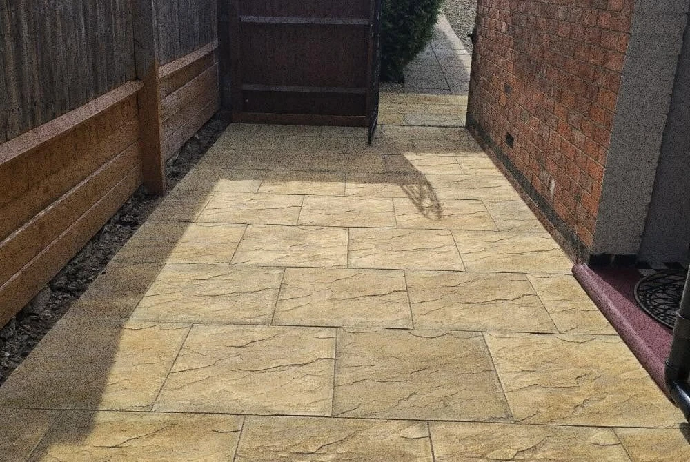 Completed pale stone side path by Boothville Services.