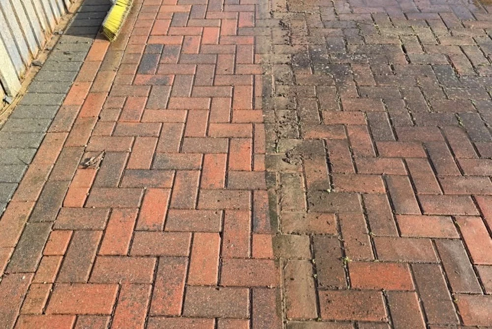 Partly cleaned block paving showing contrasting sections by Boothville Services.