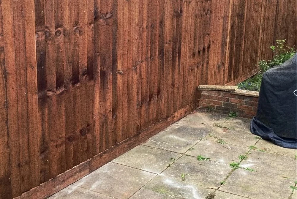 New timber fence beside paving by Boothville Services.