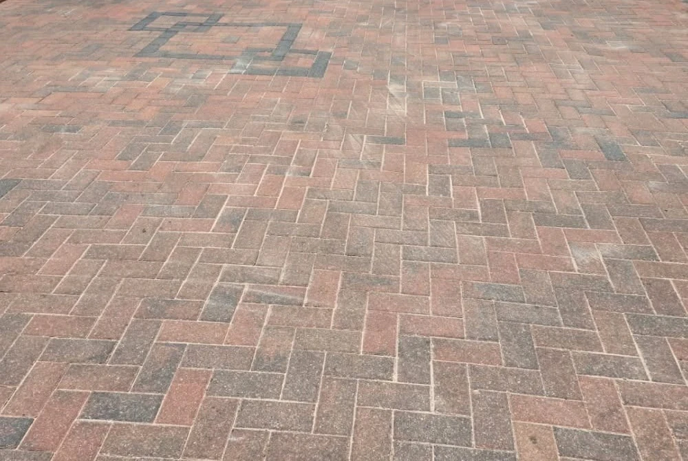 Block paving during pressure washing by Boothville Services.