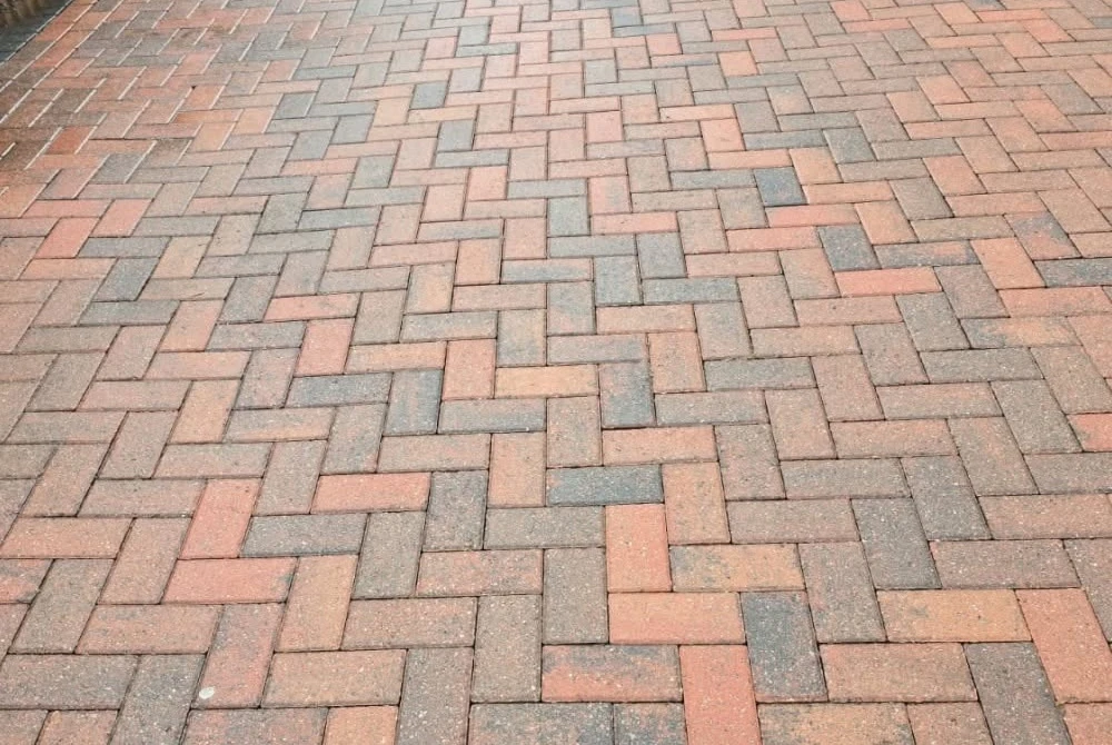 Cleaned red block-paved path by Boothville Services.