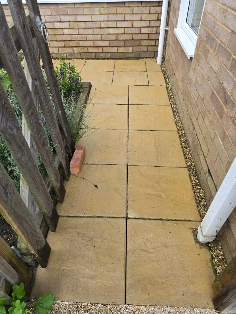 Cleaned pale paved side passage by Boothville Services.